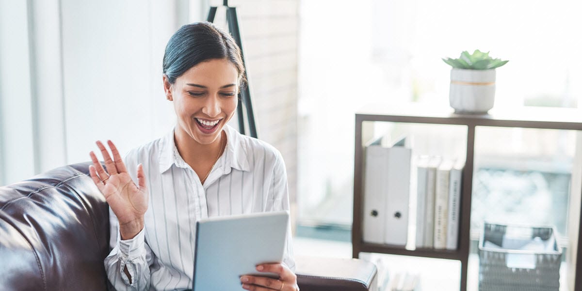 Woman outside holding tablet