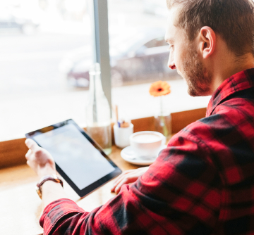 Man looking at iPad