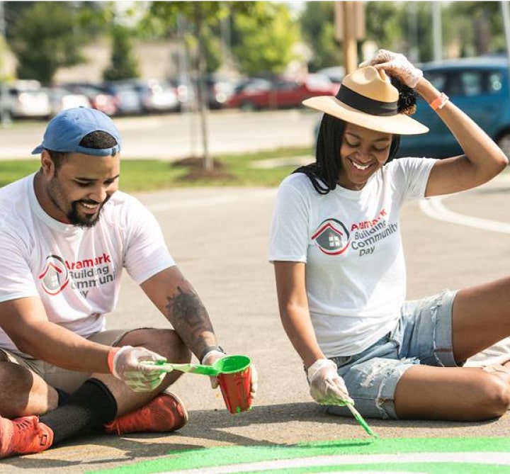 Aramark community workers painting