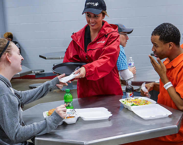 serving family meals to inmates