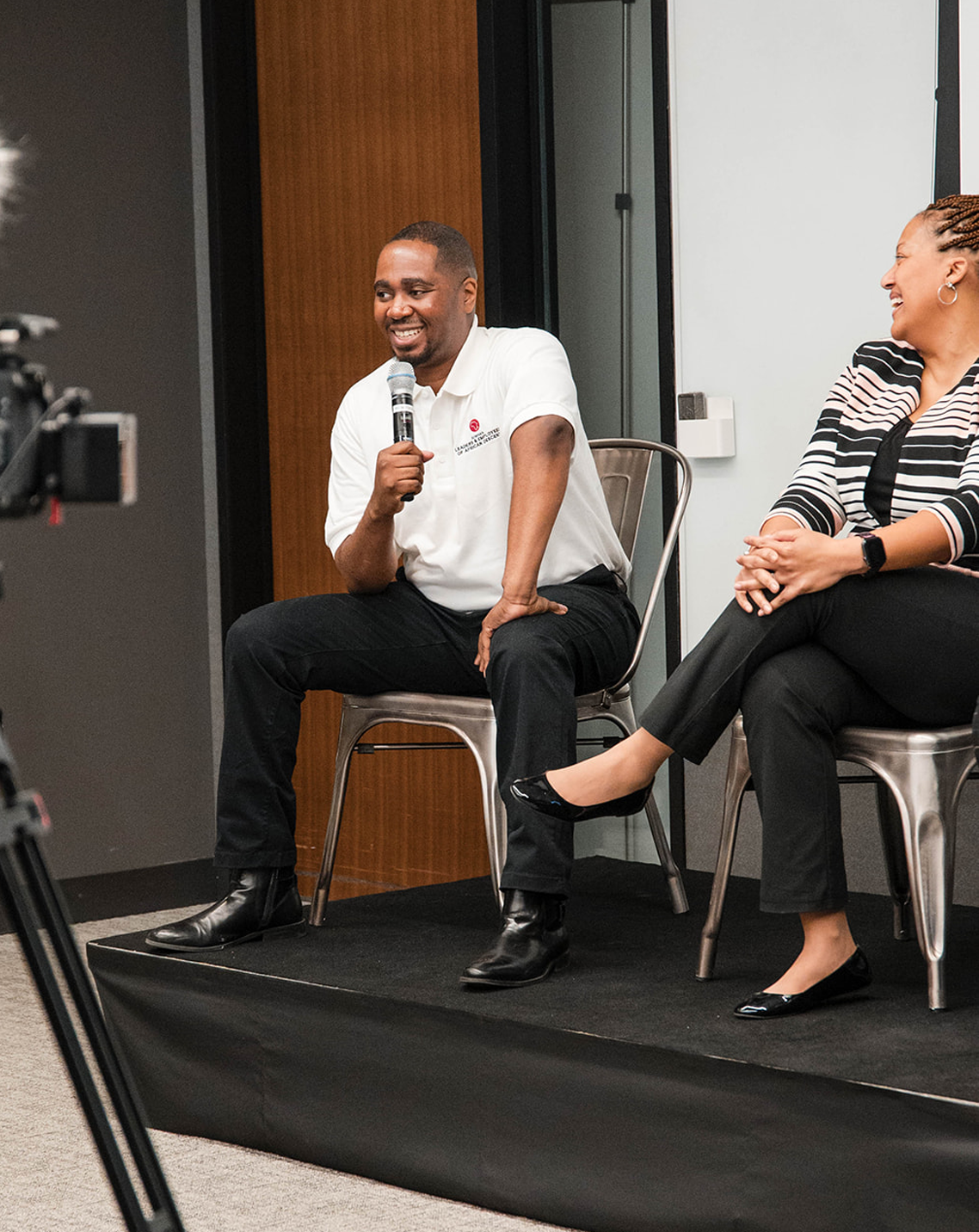 lead member speaks on a panel