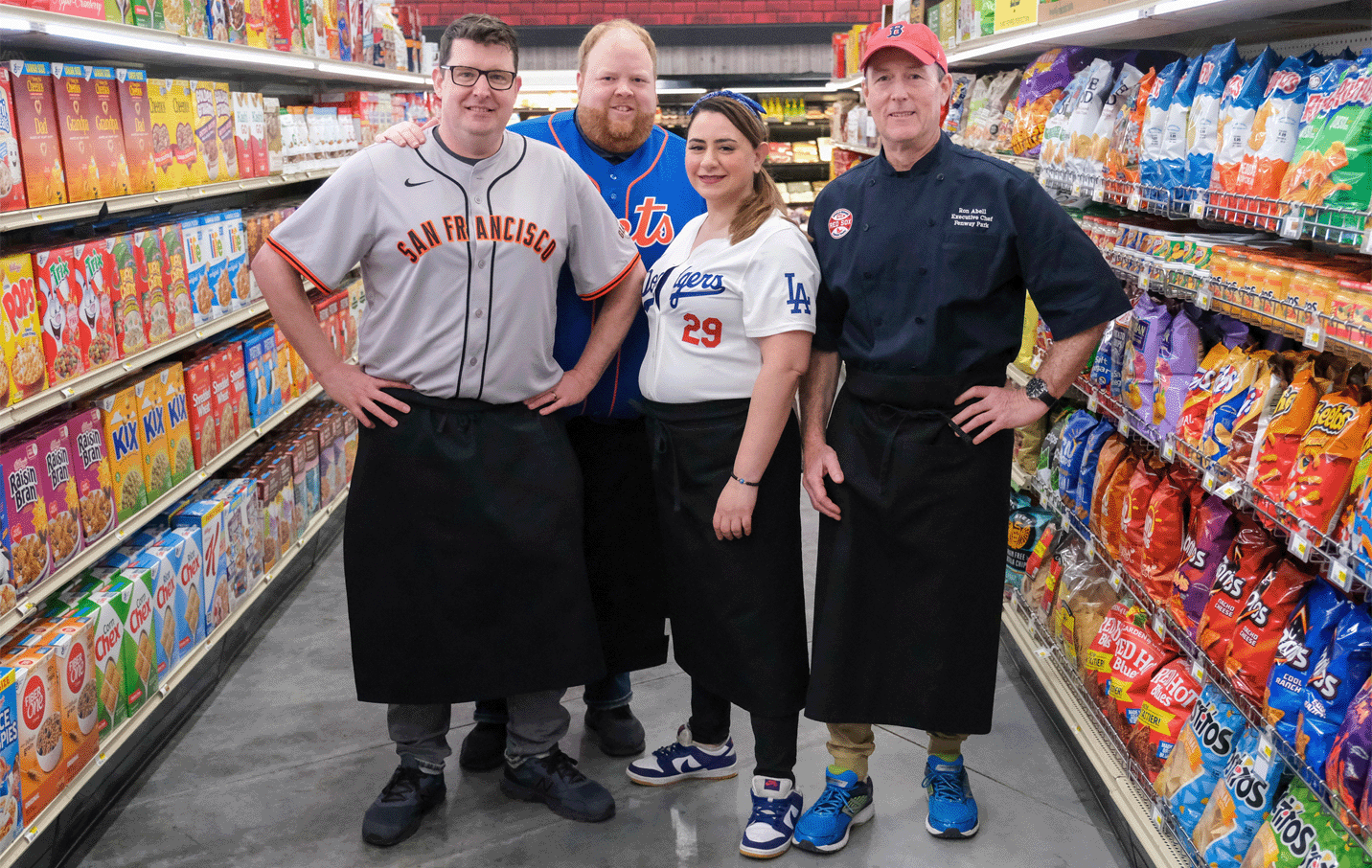 guy's grocery game participants in a grocery store aisle