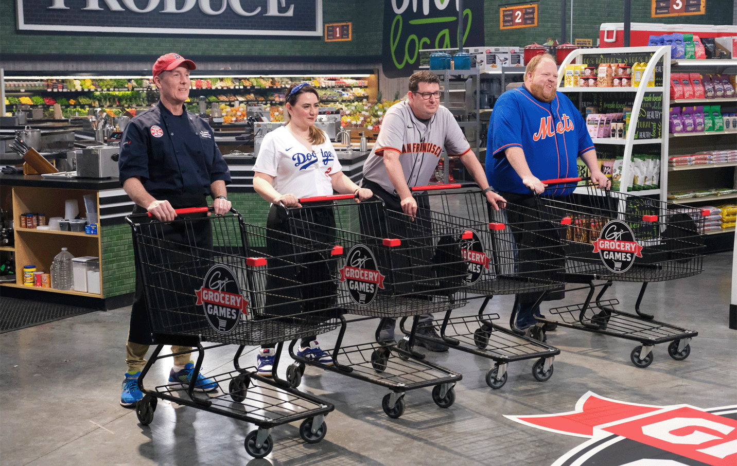 guy's grocery game participants with shopping carts