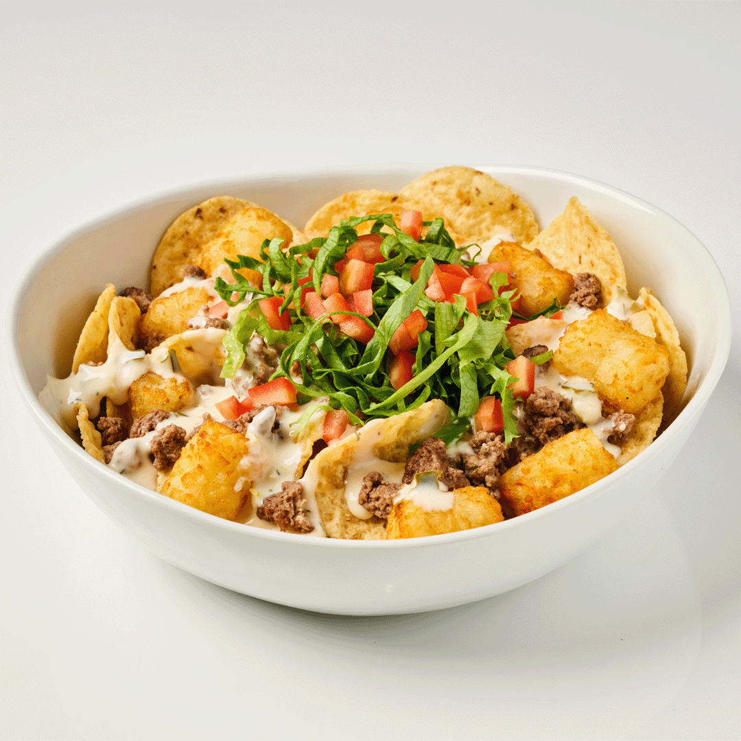 Cheeseburger nachos with pickle queso