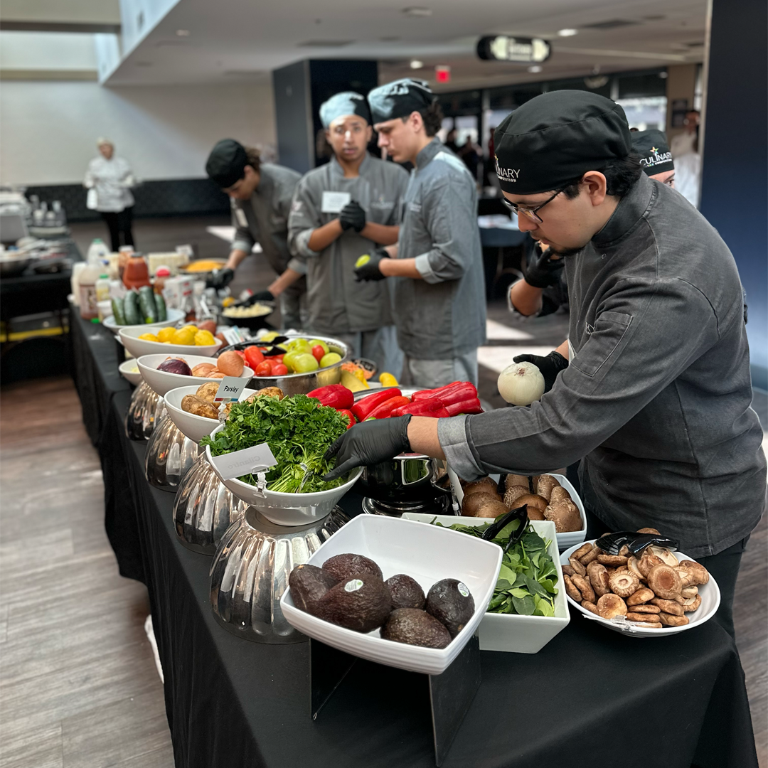 students retrieving ingredients at a table