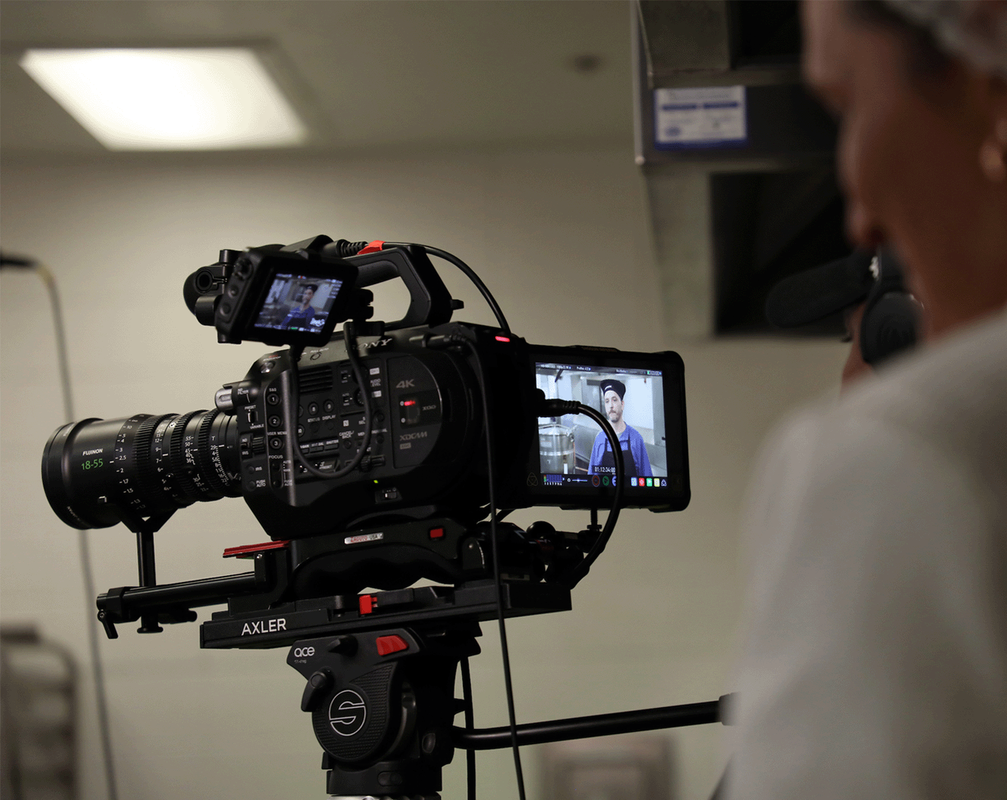 people filming a chef