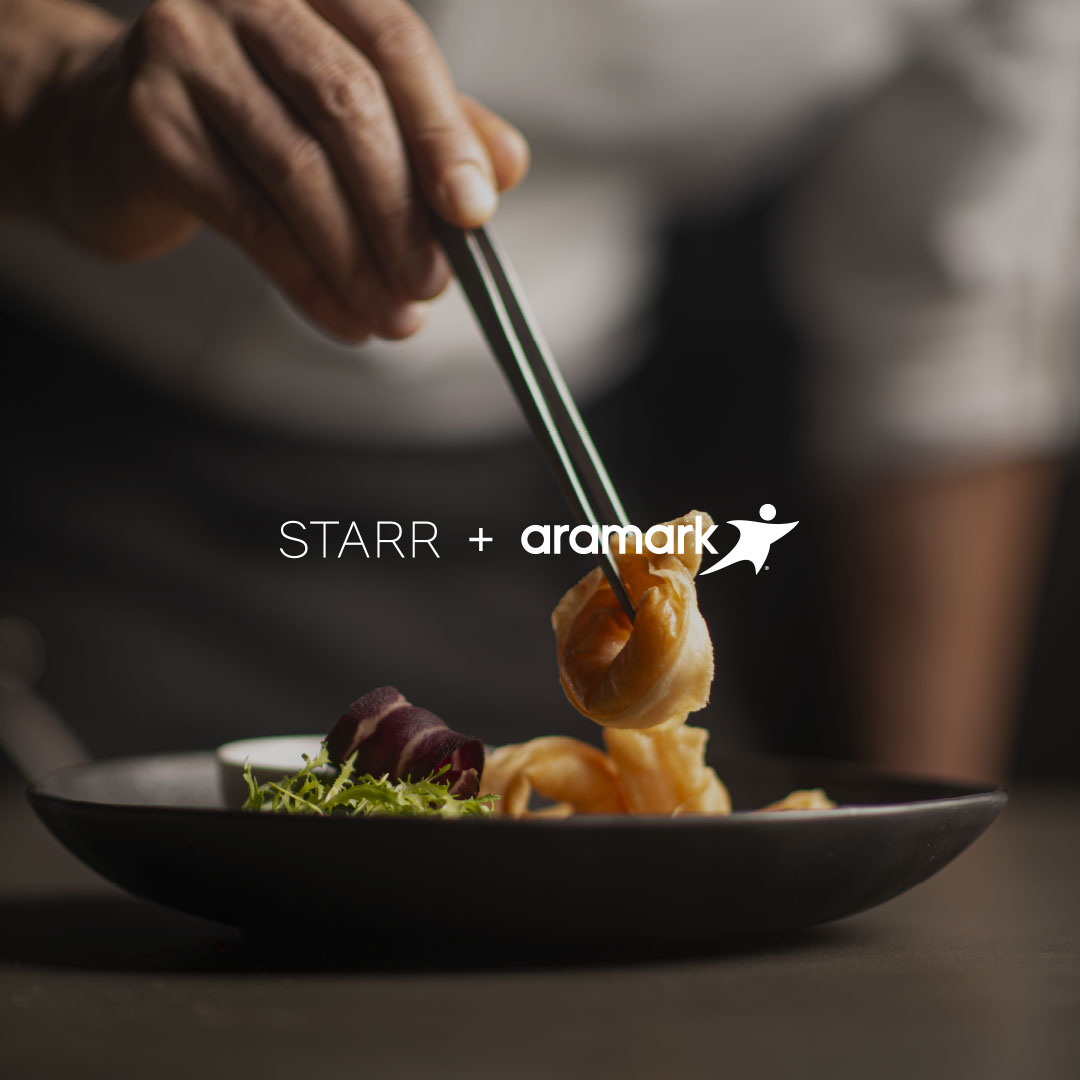 A hand using chopsticks to pick up food on a plate, and the STARR + Aramark logos.