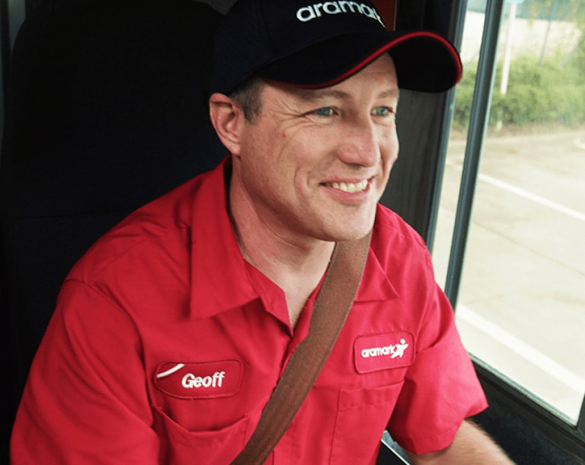 Aramark worker driving a company truck.