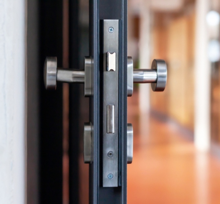 An open door showing its latching mechanisms.