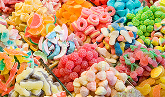 A variety of freshly-made candy in containers.