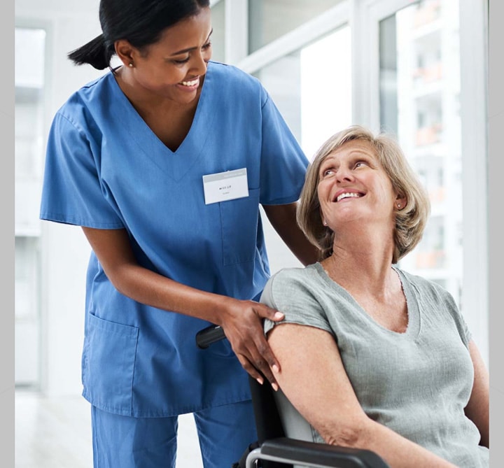 Nurse and woman smiling