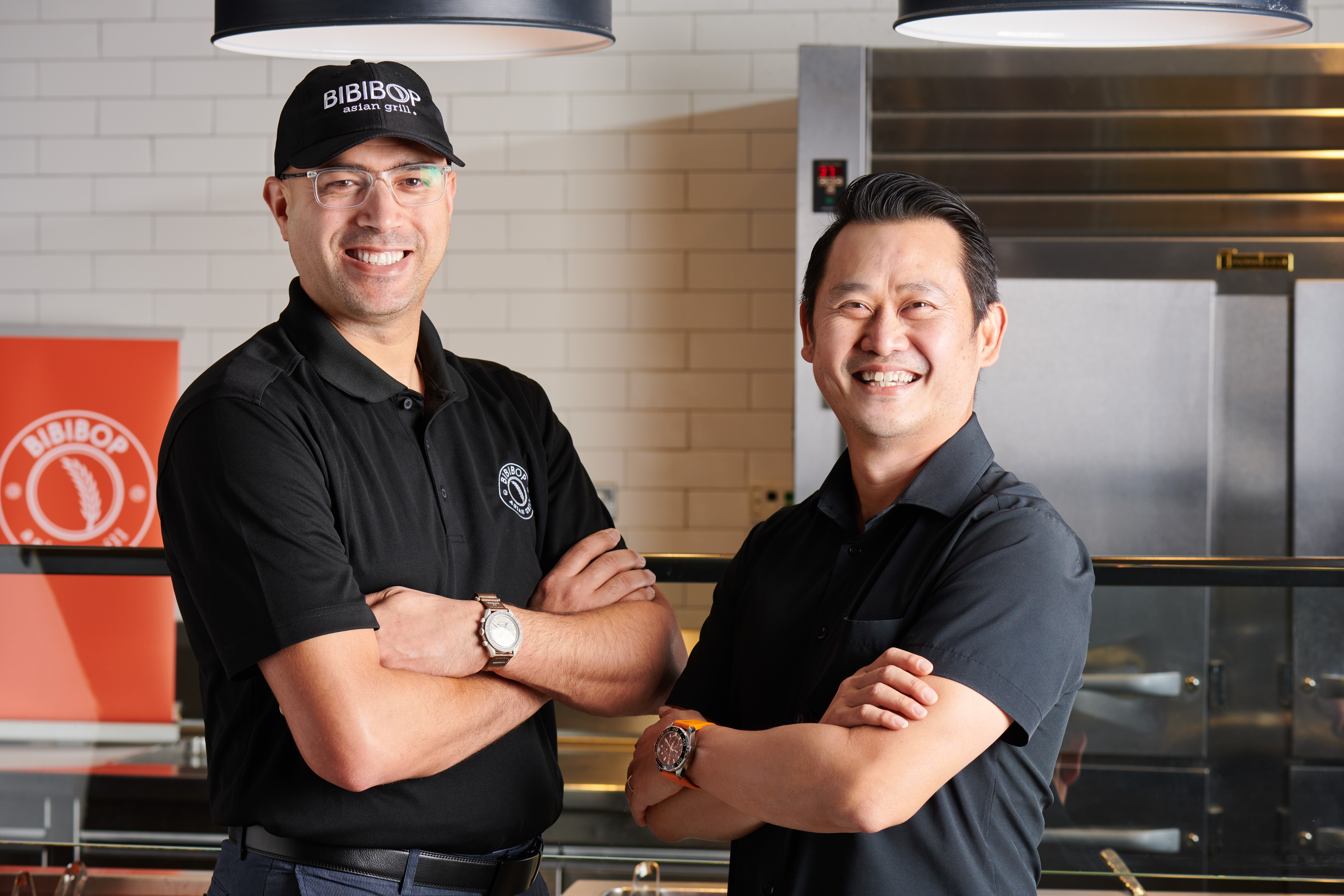 Two male Bibibop team members smiling.