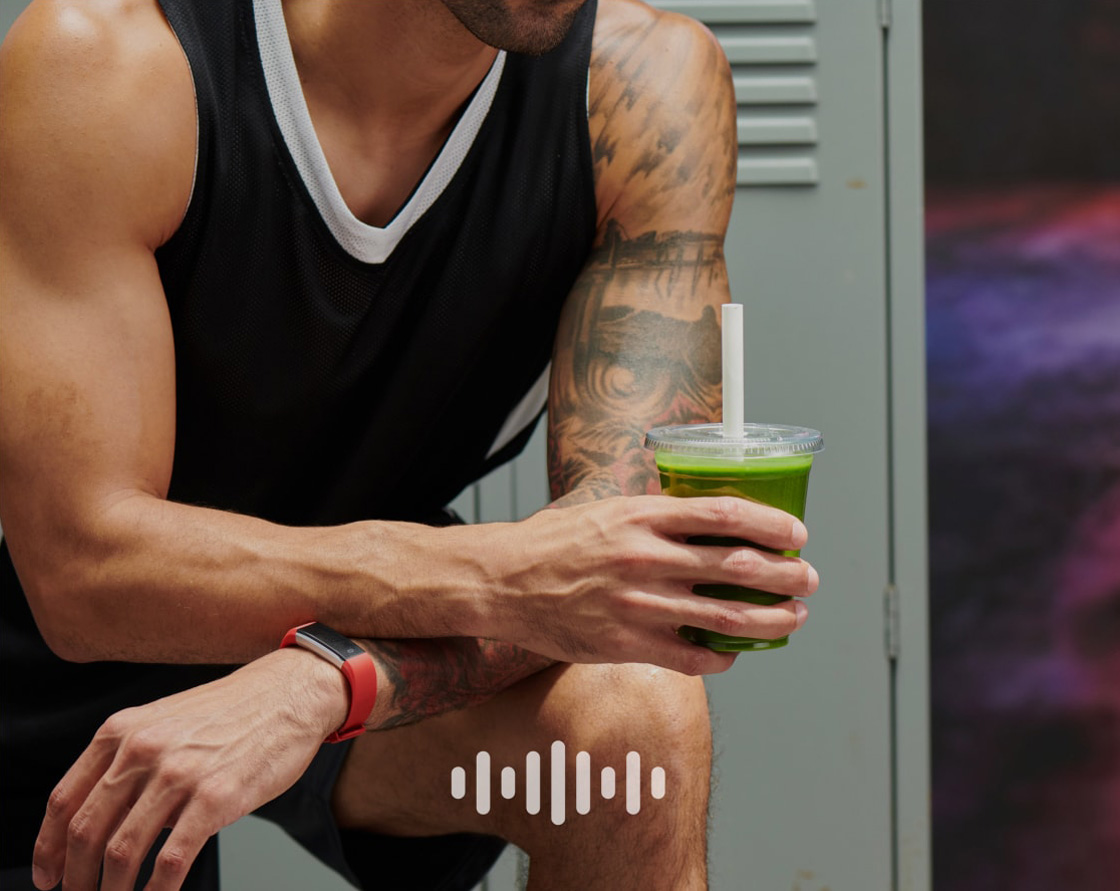Athlete in a locker room holding a green smoothie, and overlaid audio symbol.