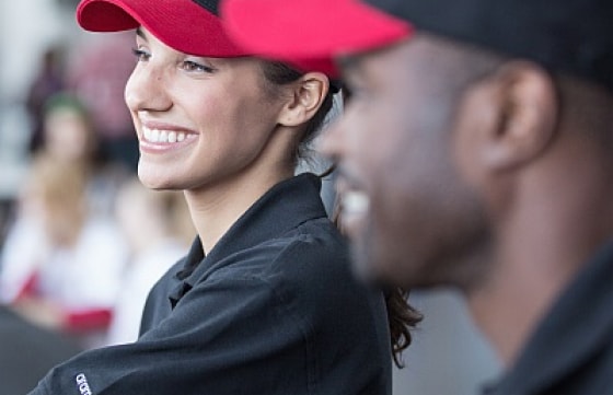 Two foodservice employees smiling
