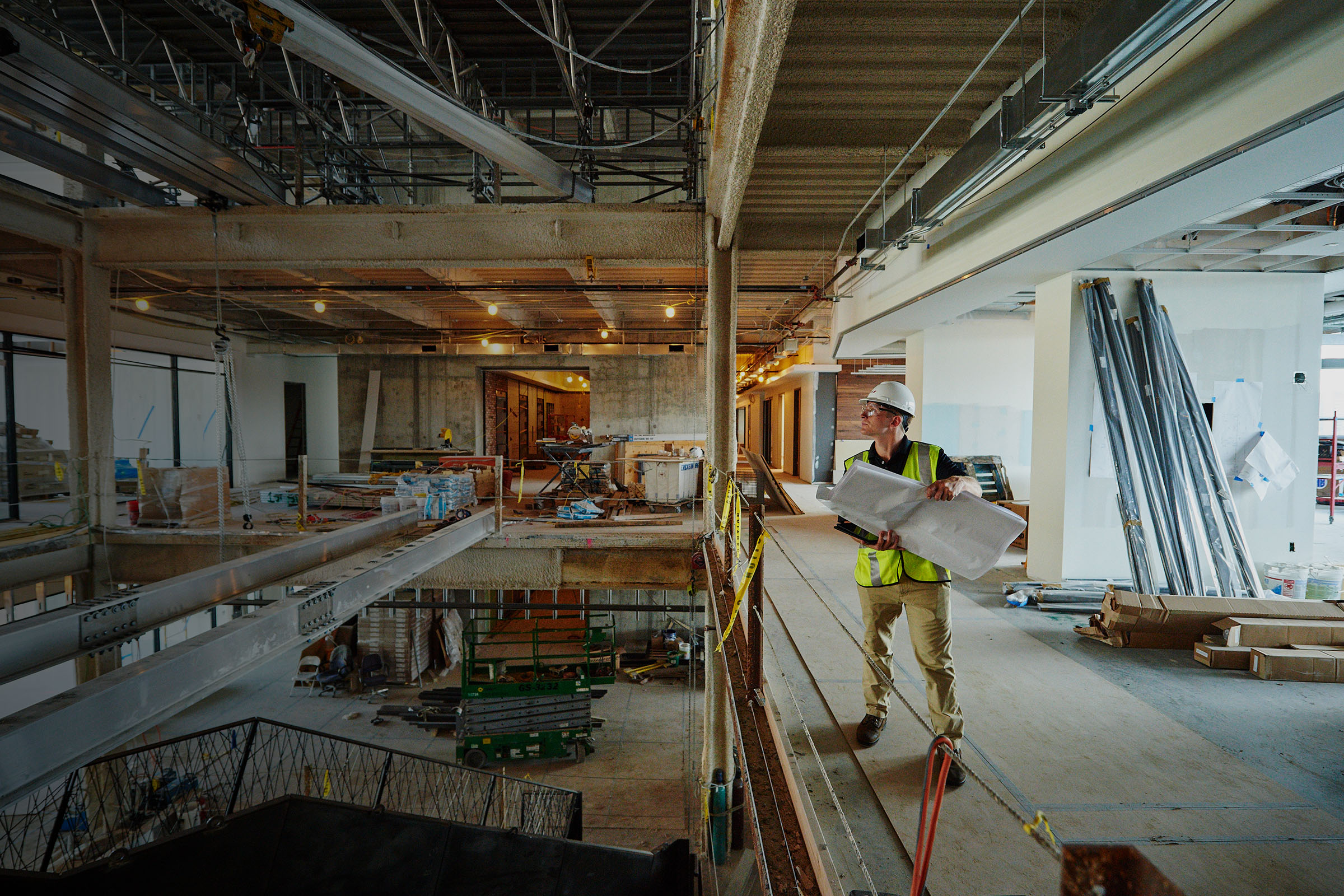 Construction worker working with heavy beams.
