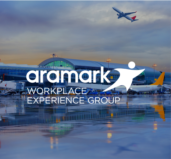 A commercial plane parked at an airport jetway, and the Aramark Workplace Experience Group logo.