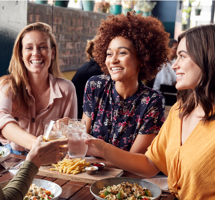 Women at lunch, toasting
