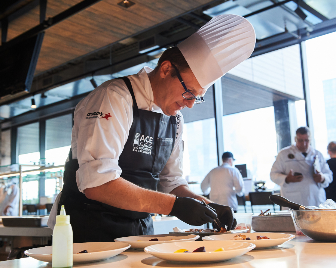 An ACE competition contestant preparing a meal.