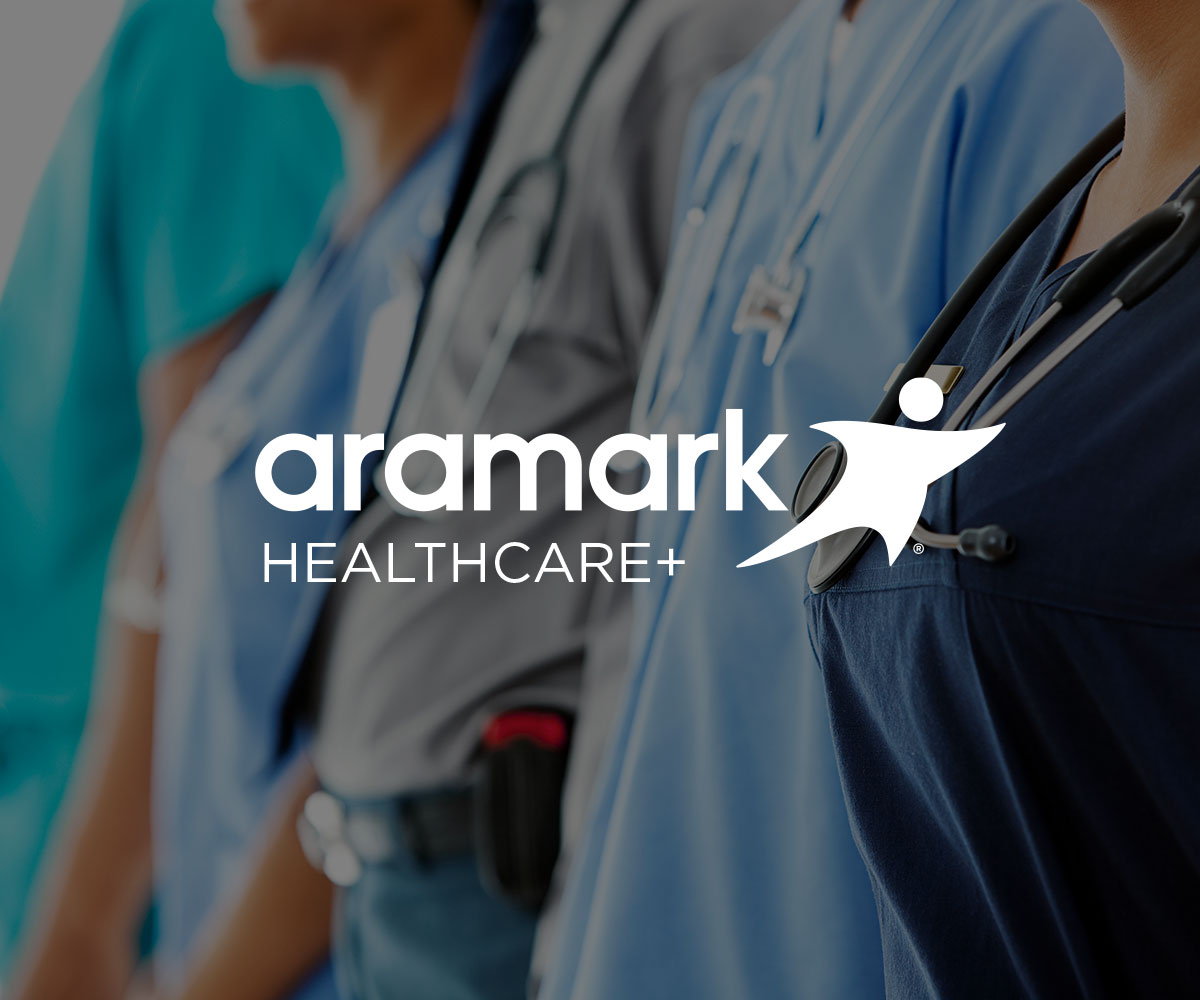 Healthcare workers with Aramark Healthcare+ logo.