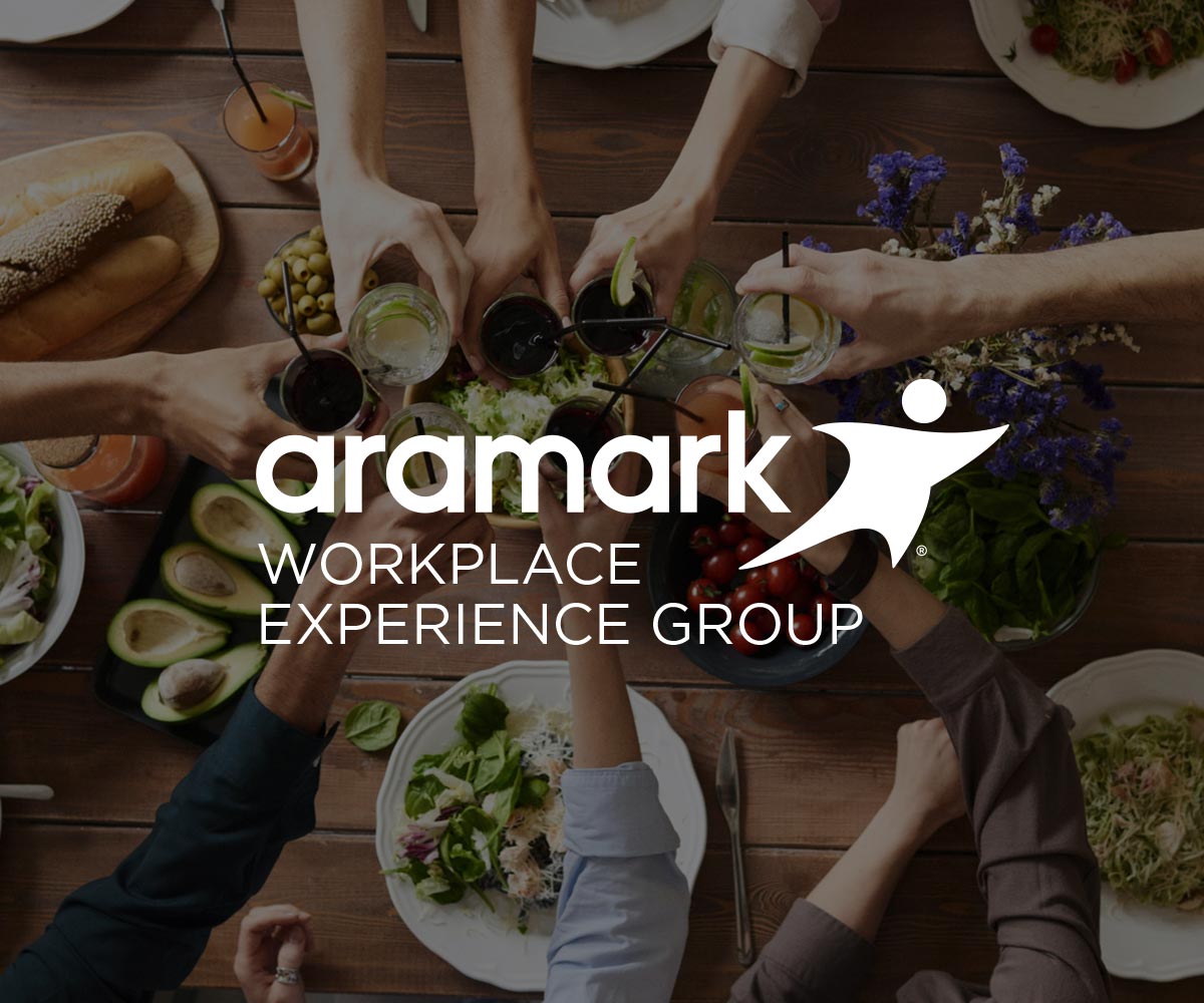 People clinking drink glasses with Workplace Experience Group logo.