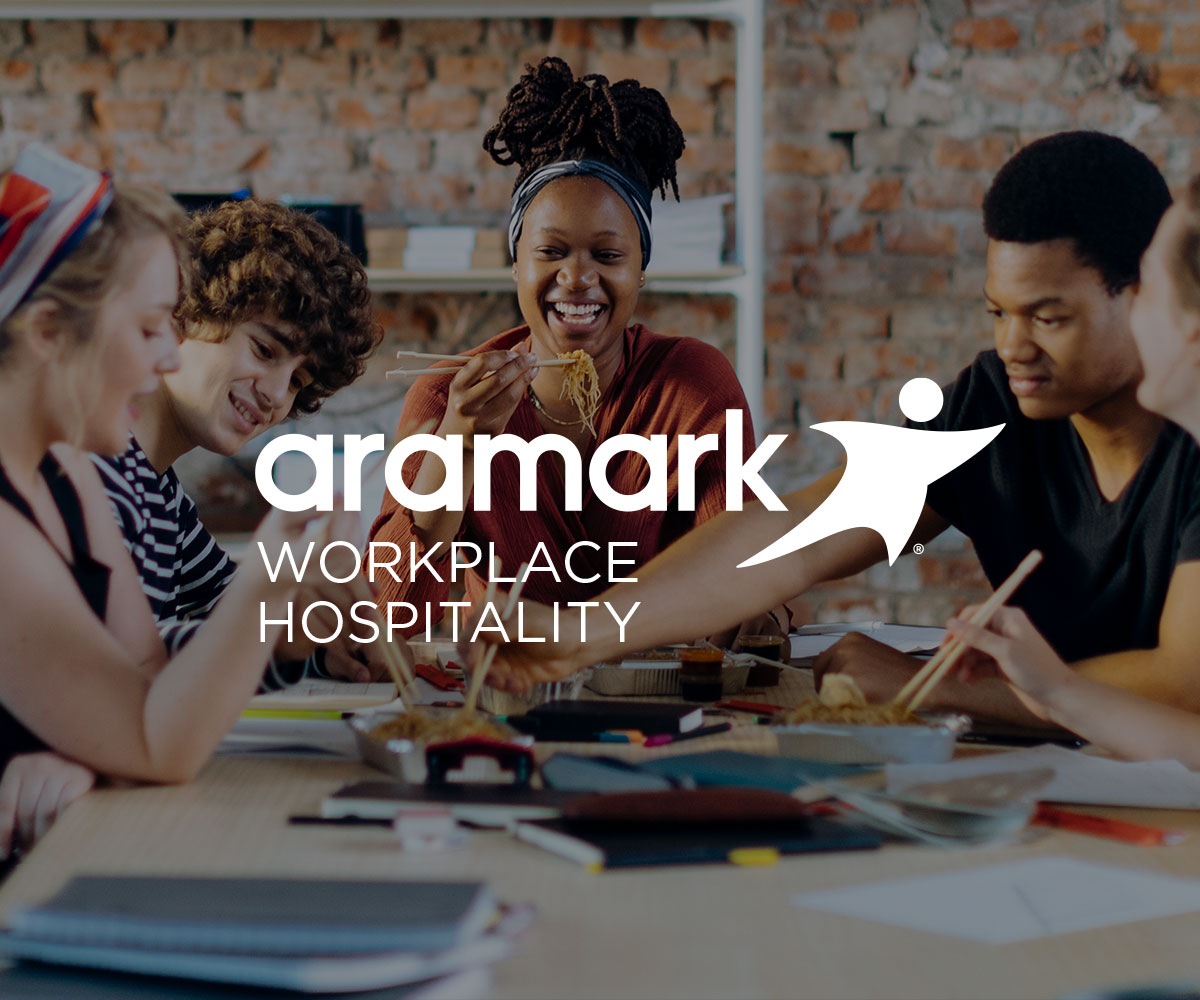 People smiling and eating with Workplace Hospitality logo.