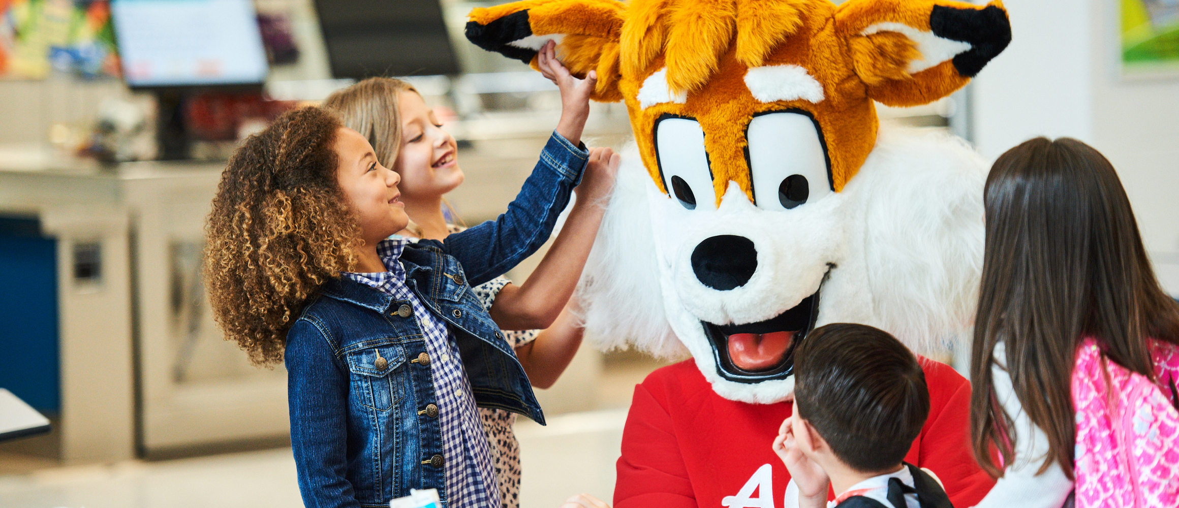 Aramark Mascot and kids playing