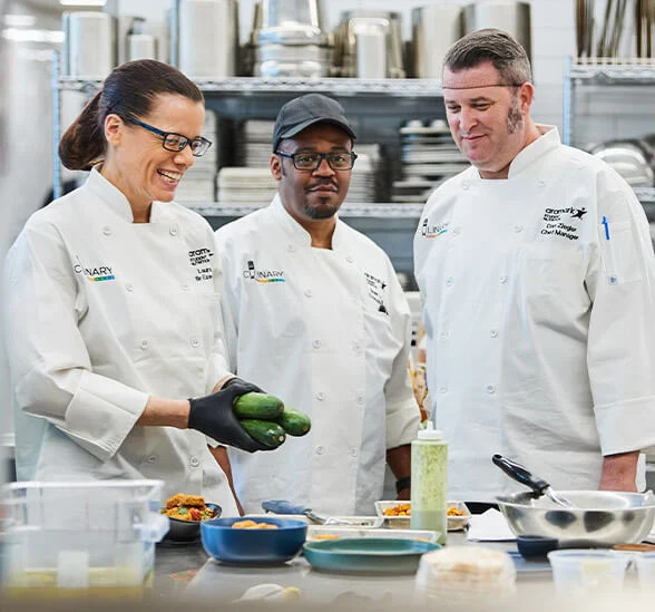 chefs discussing in kitchen
