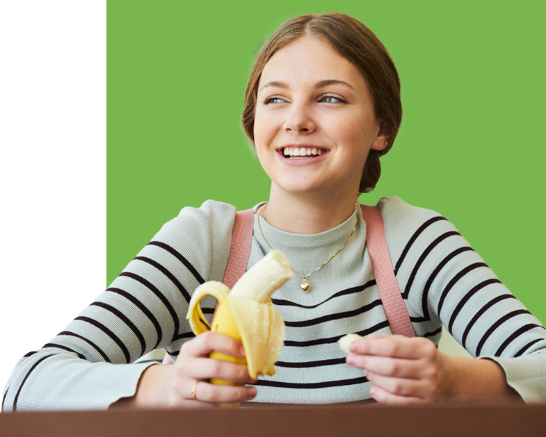 student eating banana