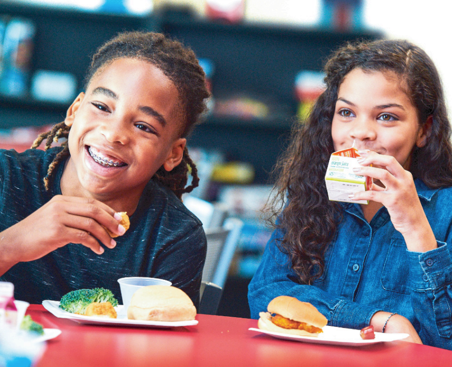 2 k-12 students eat lunch
