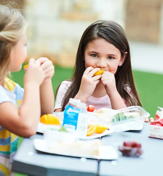 student eating fruit