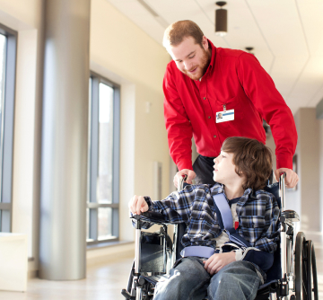 Person helping young patient