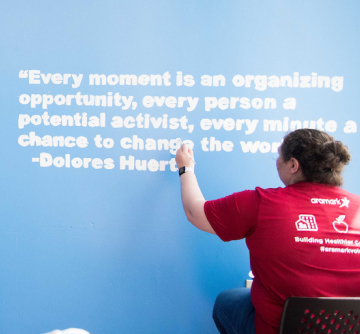 Person writing on wall