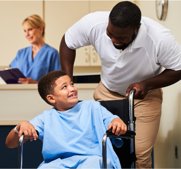 healthcare staff helping young patient