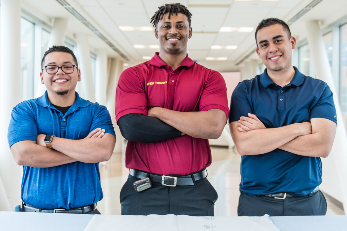 Three guys smiling for camera