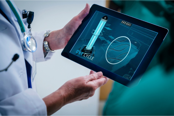 Healthcare employee holding an ipad showing innovative technology ideas