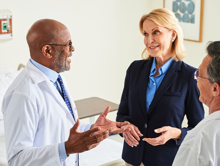 Two doctors and a hospital administrator talking.