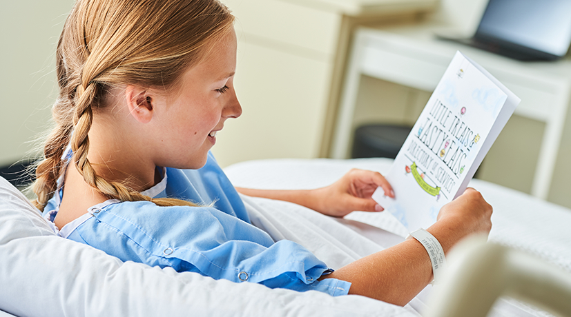 A young patient reclining reading a book.
