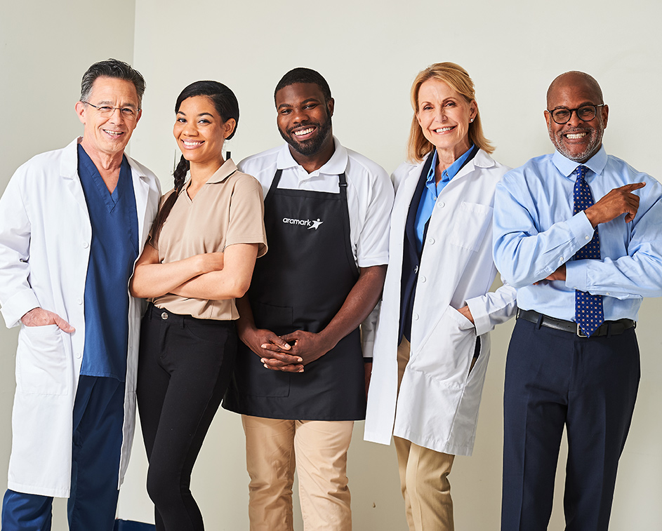 Smiling healthcare and Aramark employees. 