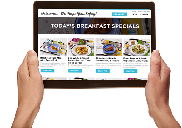 Hands holding a tablet with a meal ordering interface showing today's breakfast specials.