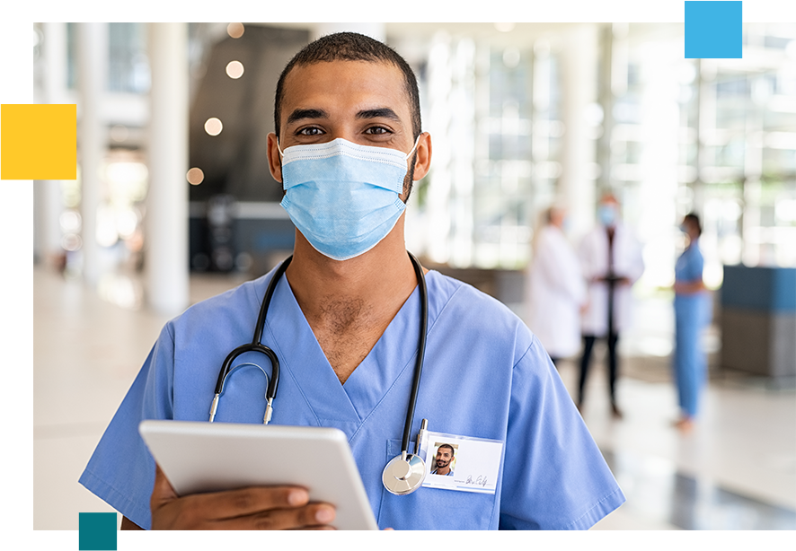 Masked nurse with a stethoscope holding a tablet.