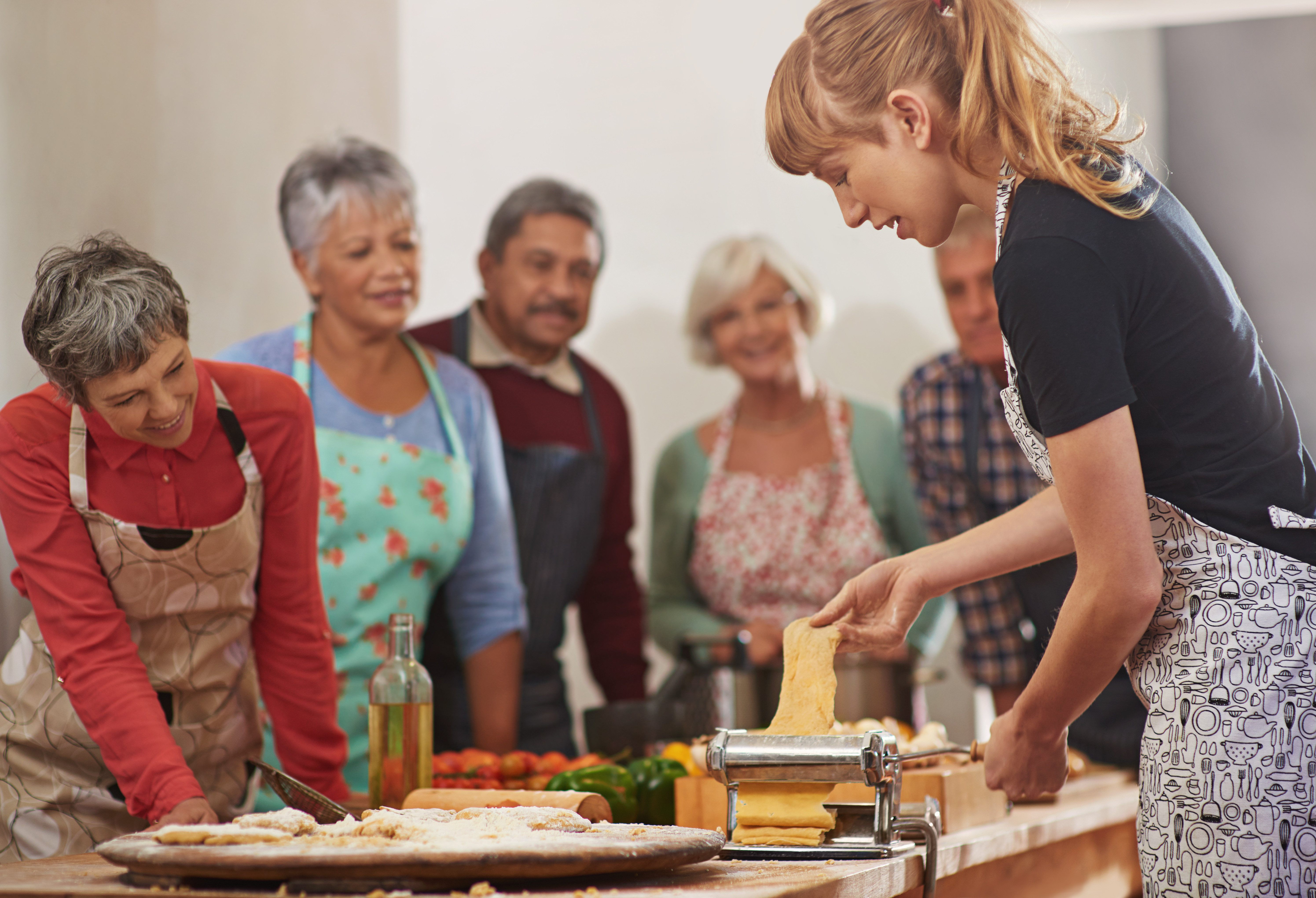 group of seniors observing cooking class