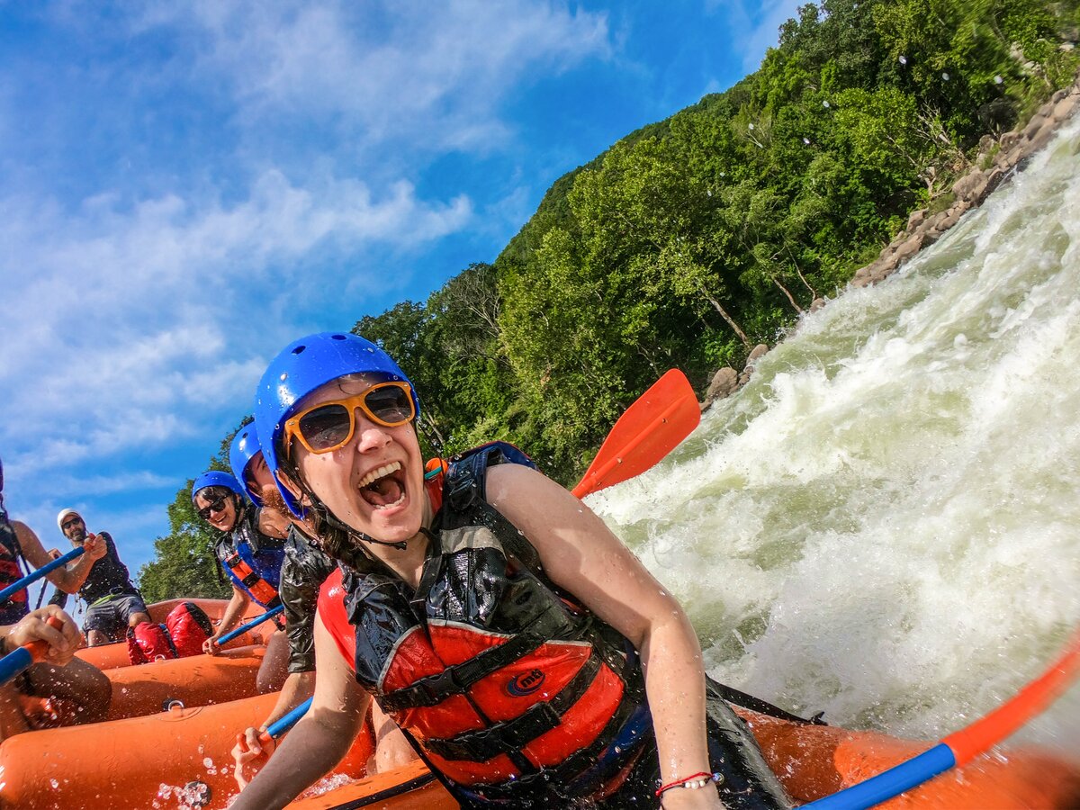 A group of people whitewater rafting.