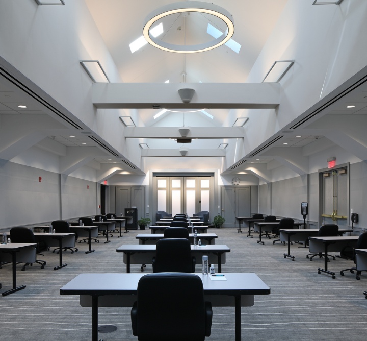 A large atrium with desks and chairs.