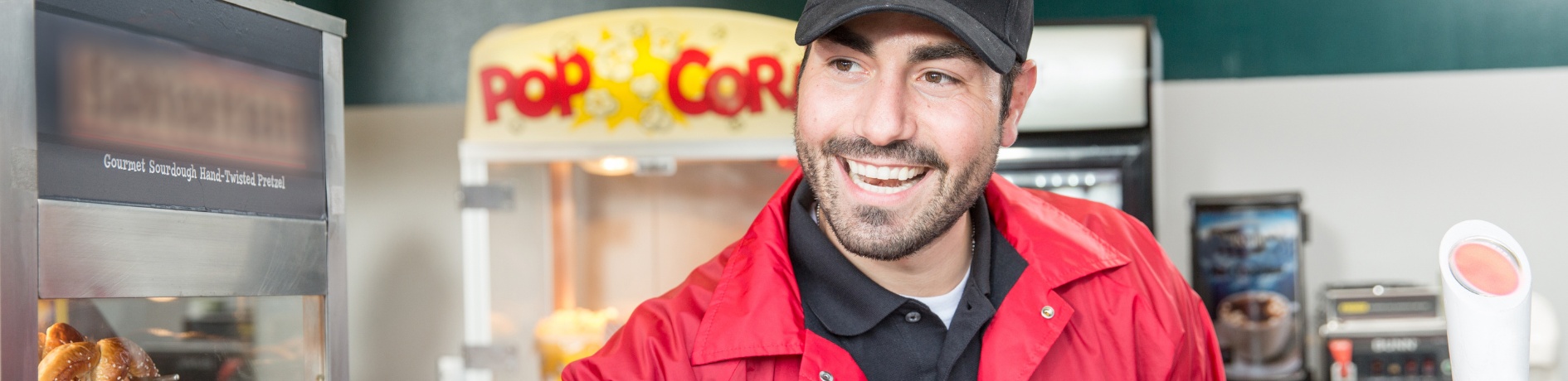 Aramark employee at stadium concession stand.