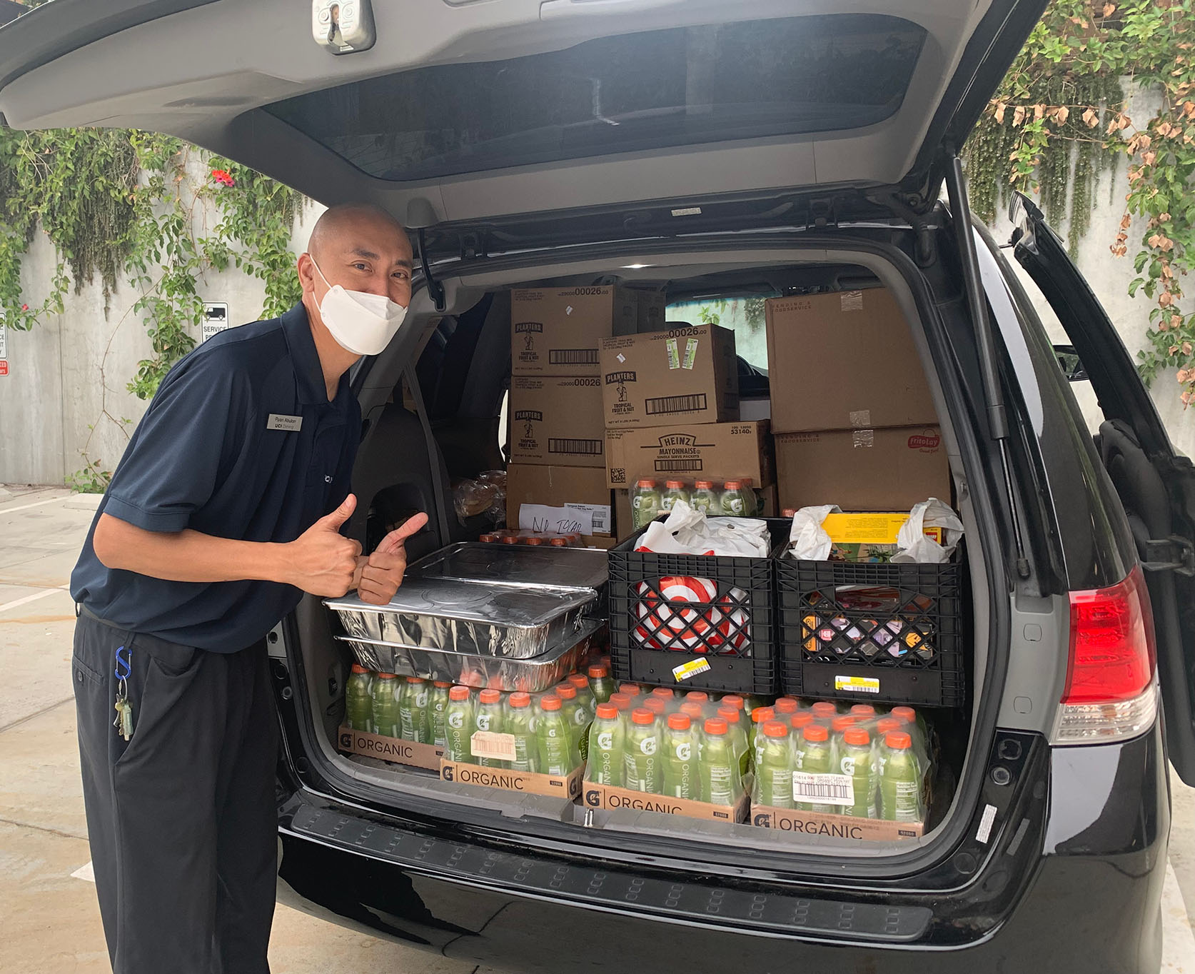Amplify member donating food and drinks