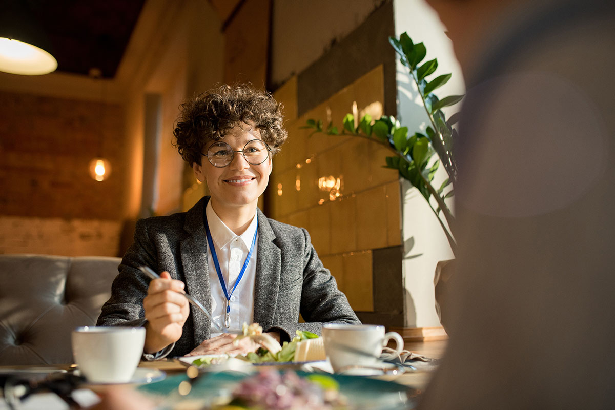 Woman eating and smiling