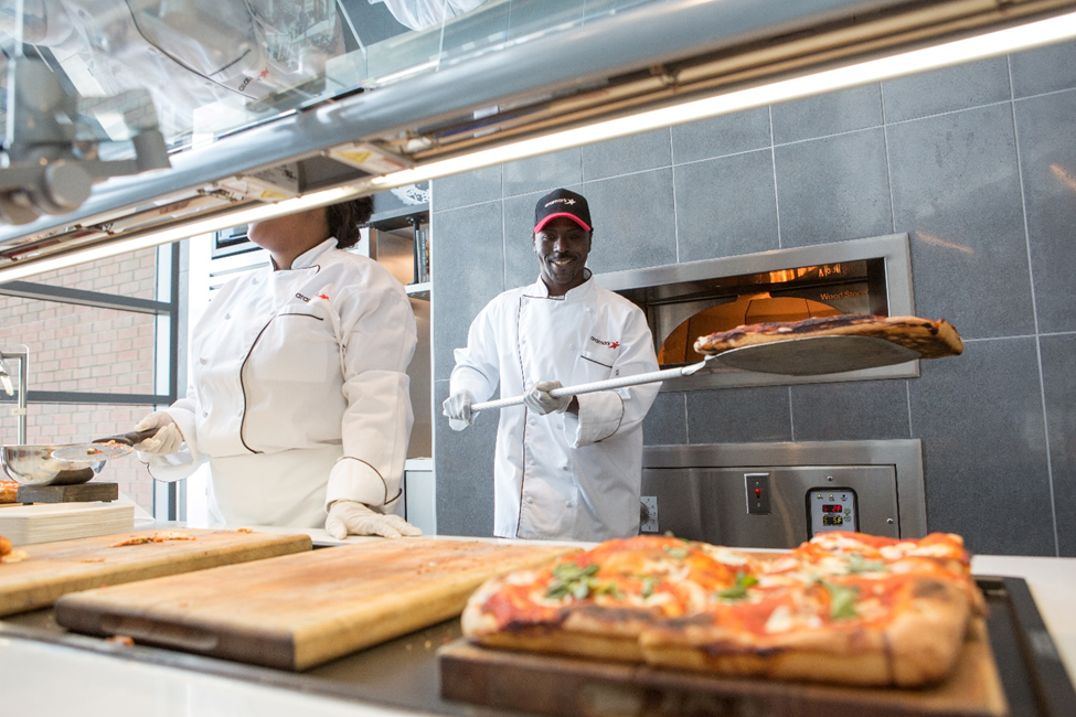 Chefs making pizza